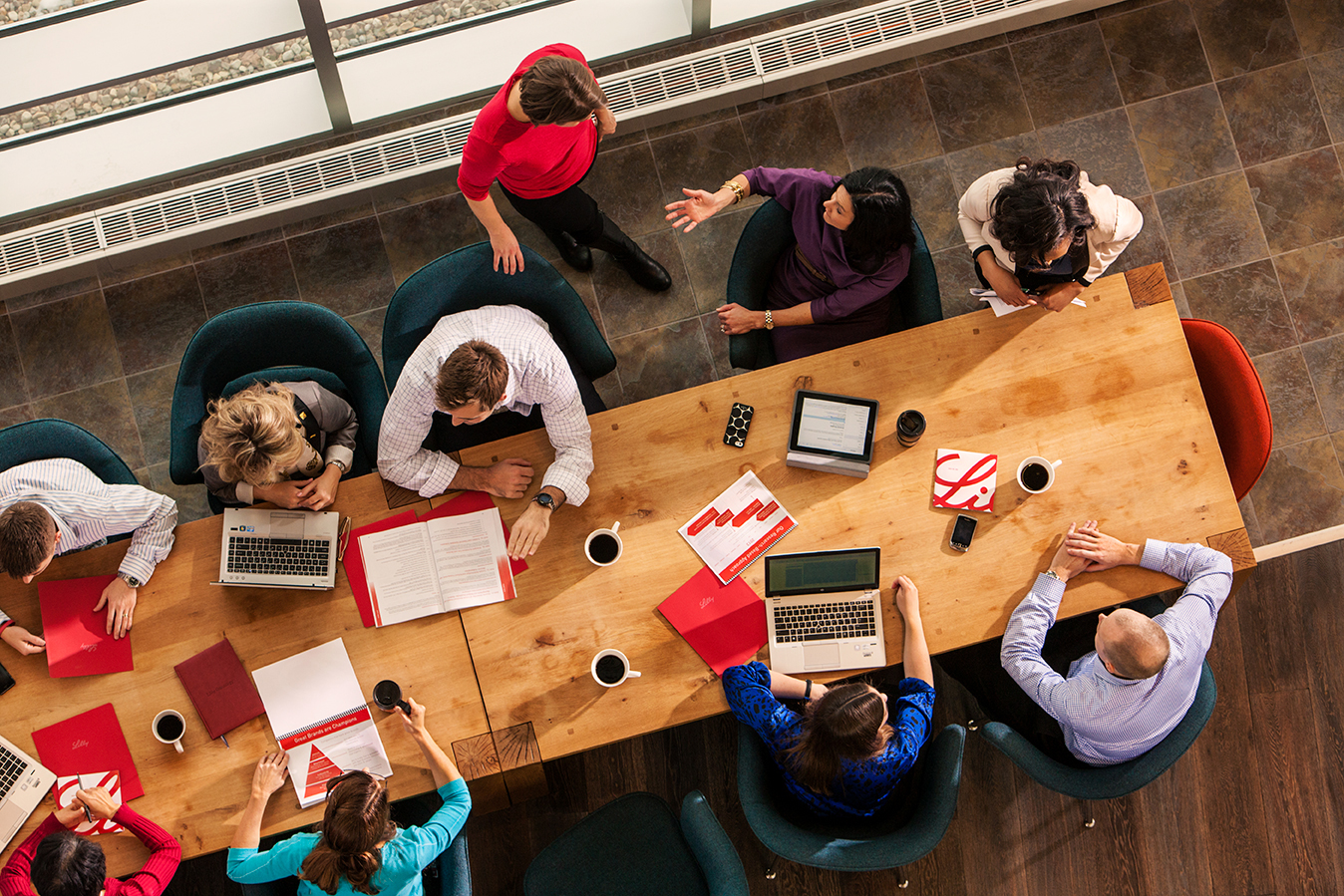 Lilly employees collaborating on a project in a conference room